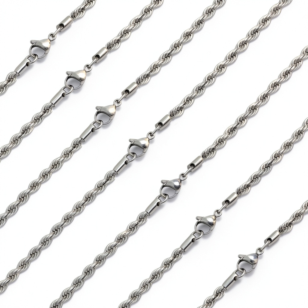 Stino stainless steel chains in various styles displayed on a crafting table